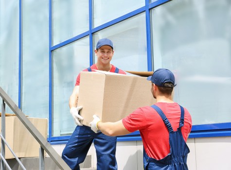 Moving home service in Friern Barnet with packed boxes and furniture