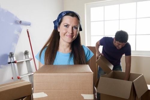 Loading household furniture into a van for a Friern Barnet move