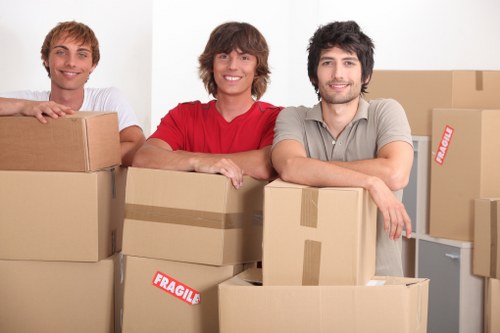 Careful loading of sofas and tables during furniture pick-up in Friern Barnet