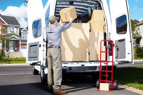 Unpacking and arranging household essentials in a new Friern Barnet home