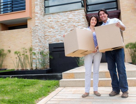 Movers loading business items with care during a Friern Barnet relocation