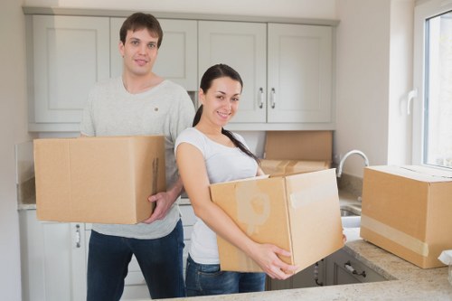 Local moving team handling boxes and furniture in Friern Barnet
